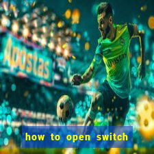 how to open switch oled game card slot